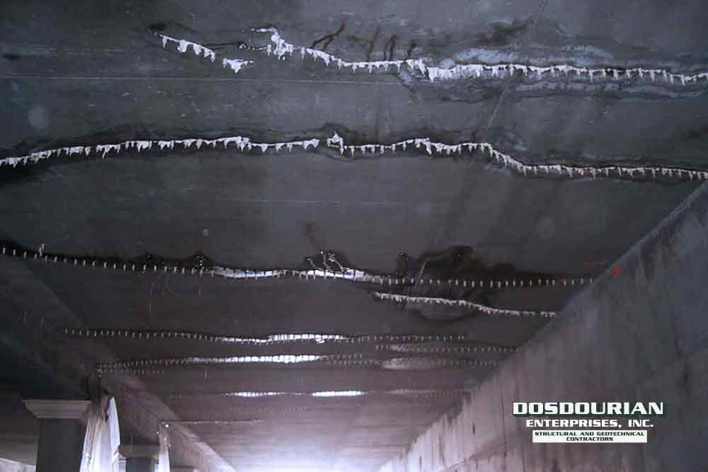 Polyurethane Grout is used to stop water that is seeping through the ceiling in a concrete tunnel.